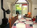 view of wood stove from bed